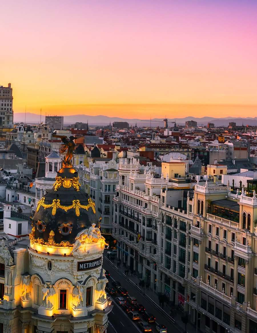 Madrid skyline at sunset, featured in the Brooke House PRO brochure