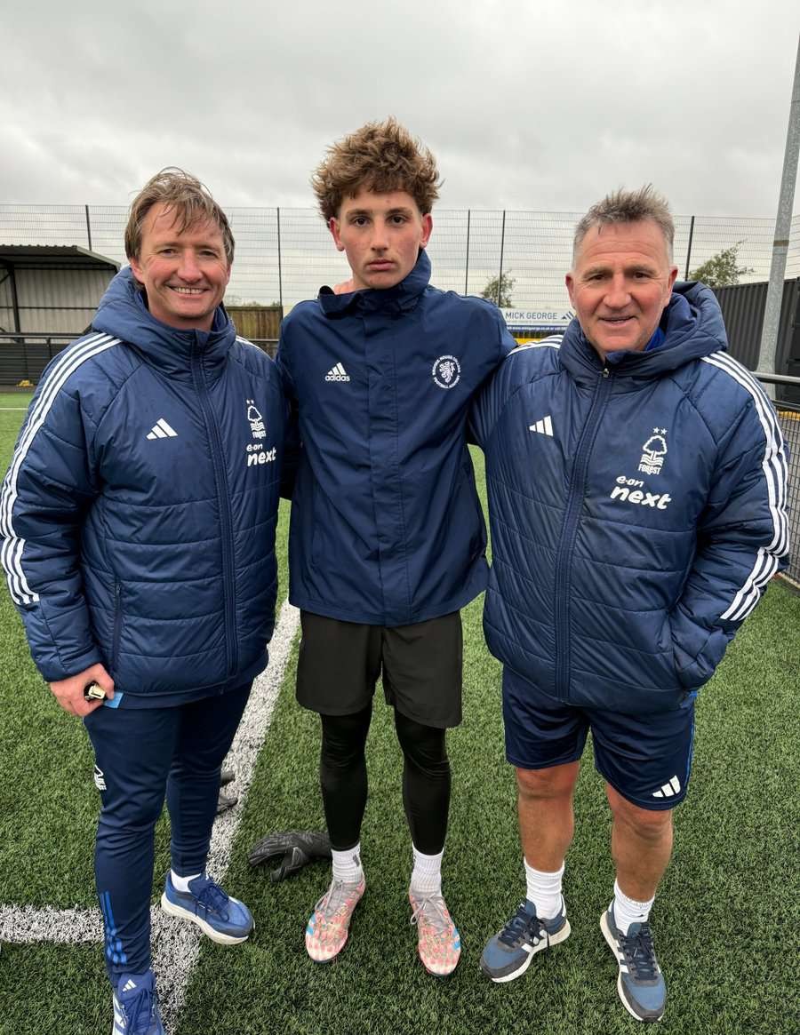 Brooke House player with coaching staff on the training field