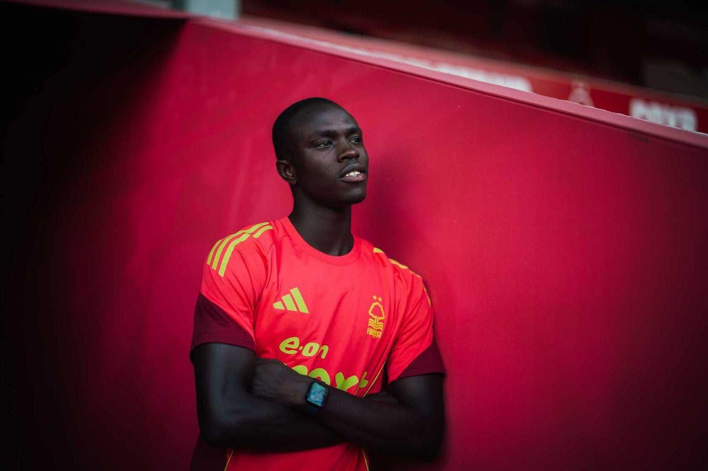 Soccer player in a red Nottingham Forest training jersey