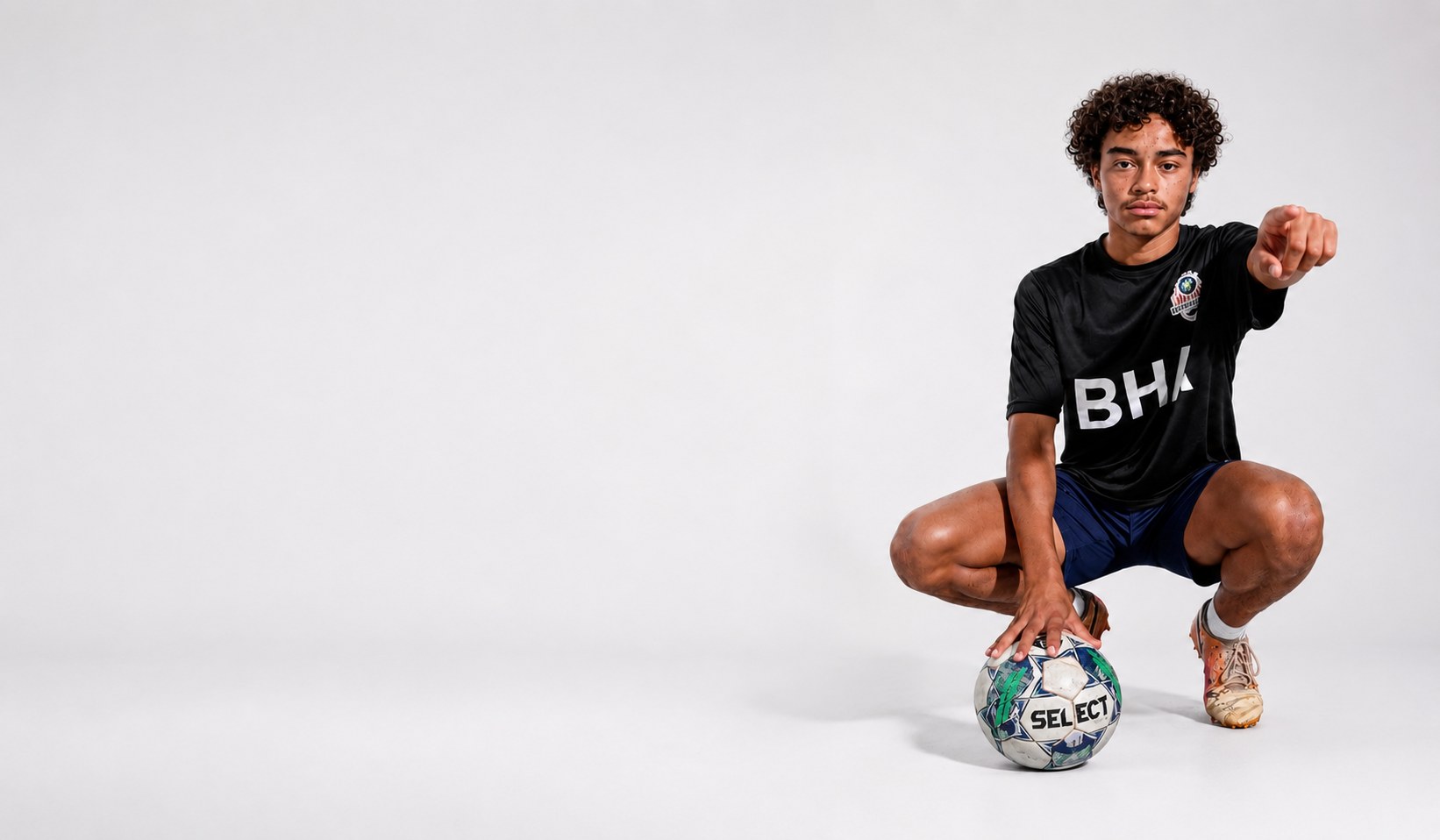 Brooke House Academy student-athlete with a soccer ball