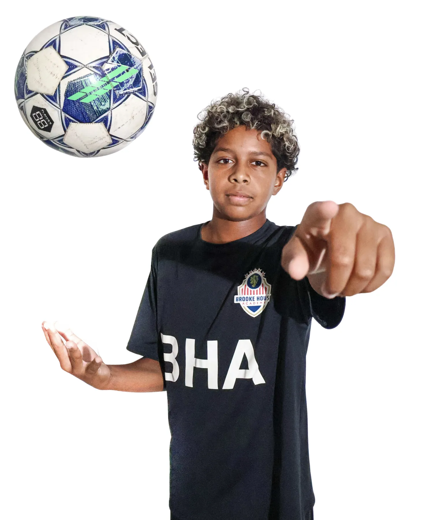 Brooke House student-athlete balancing a soccer ball