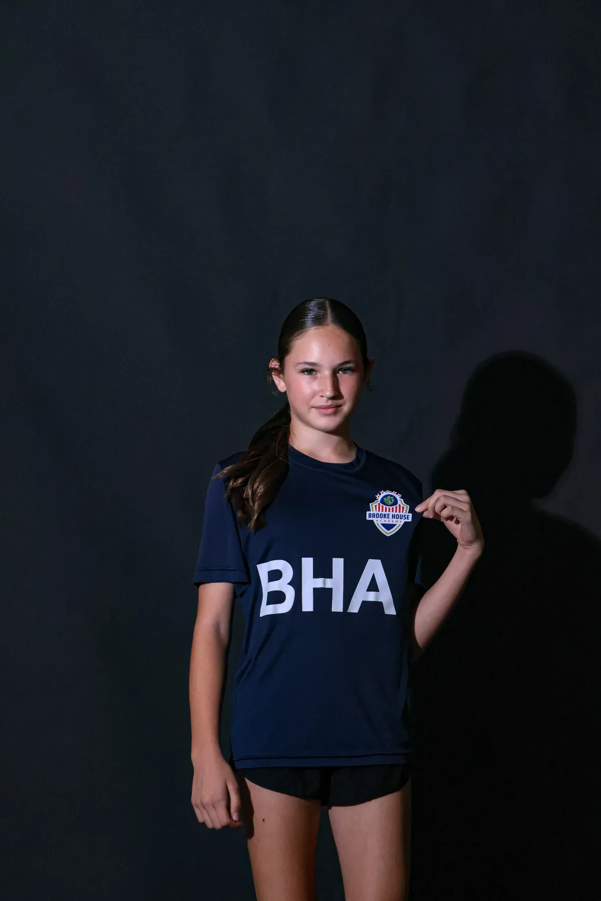 Brooke House Academy student-athlete in navy training kit