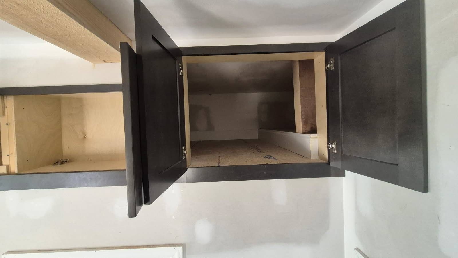 Open cabinetry showing interior and door details