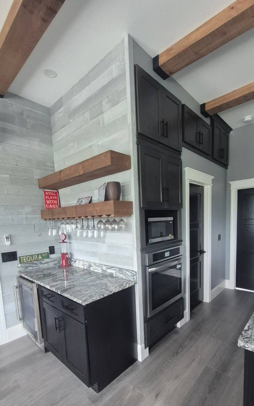 Tall cabinetry alongside wood shelving