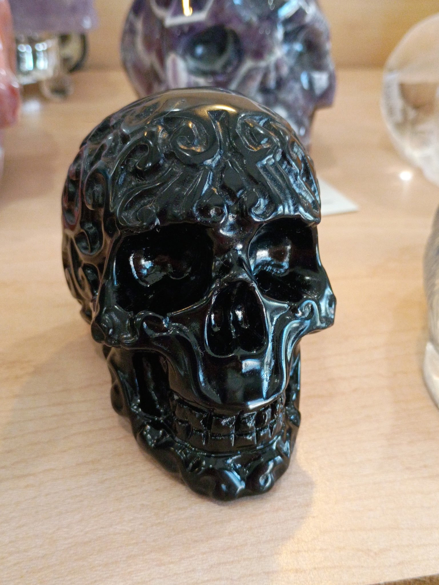 Carved dark stone skull