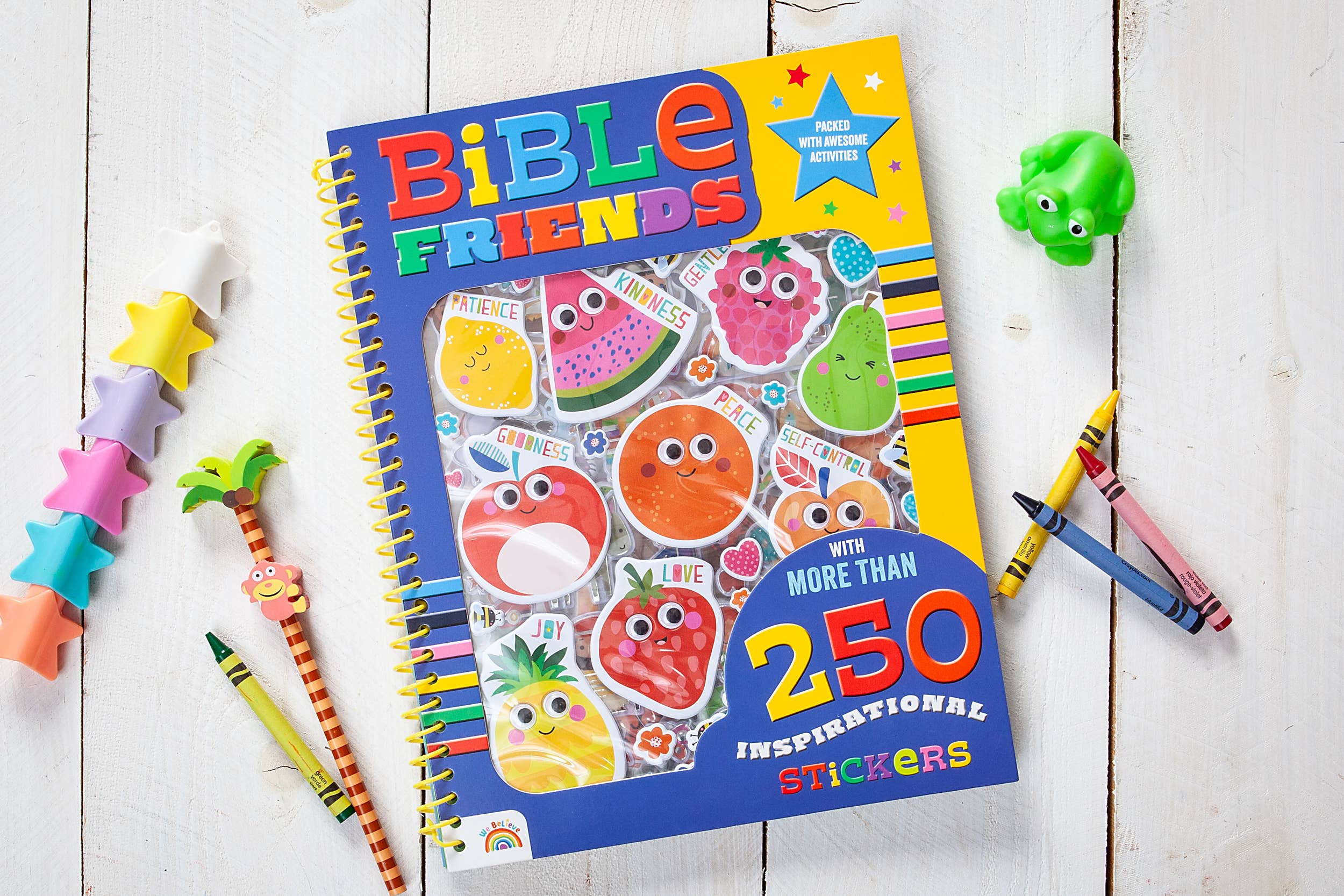 Bible Friends sticker activity book with colorful fruit character stickers, crayons, and star-shaped erasers