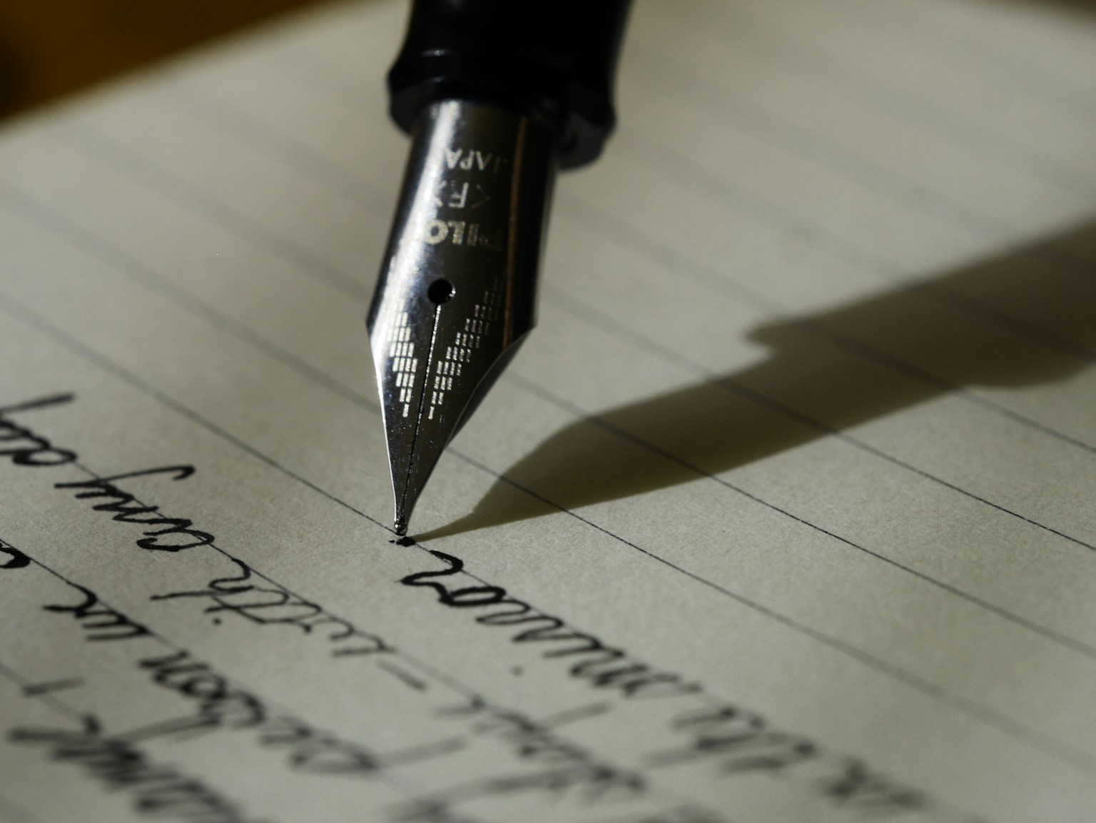Fountain pen writing on a lined page