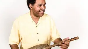 Pascal Bokar holding a ngoni