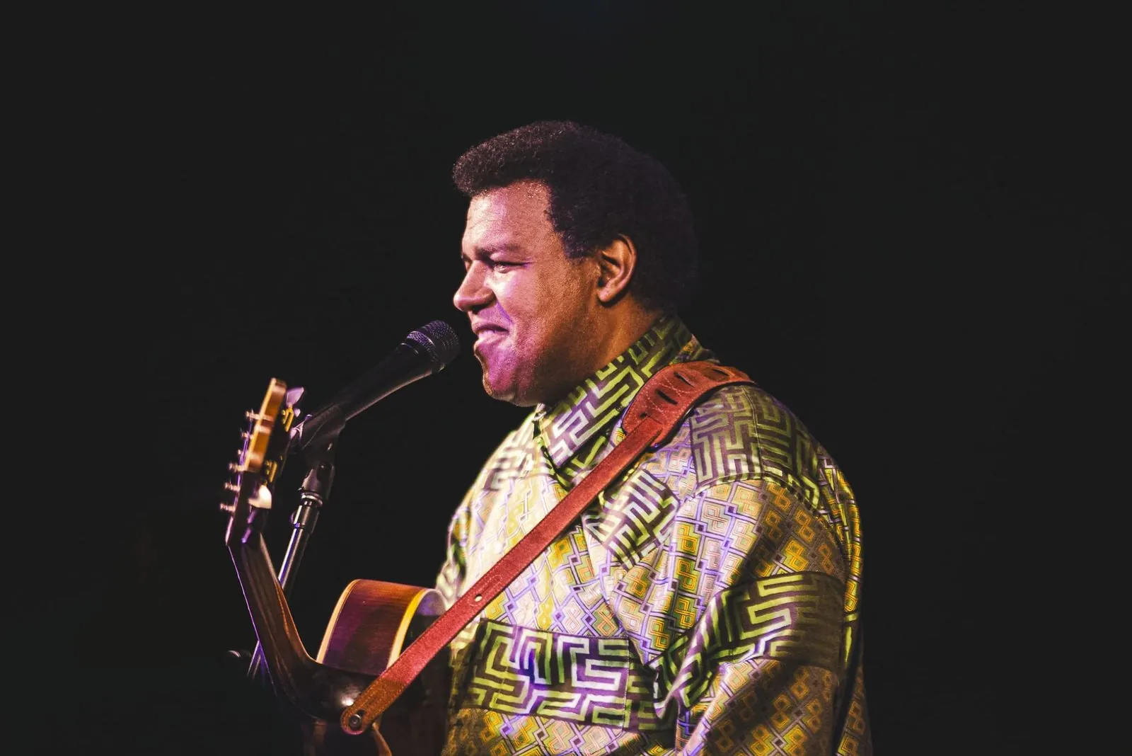Pascal Bokar performing guitar onstage