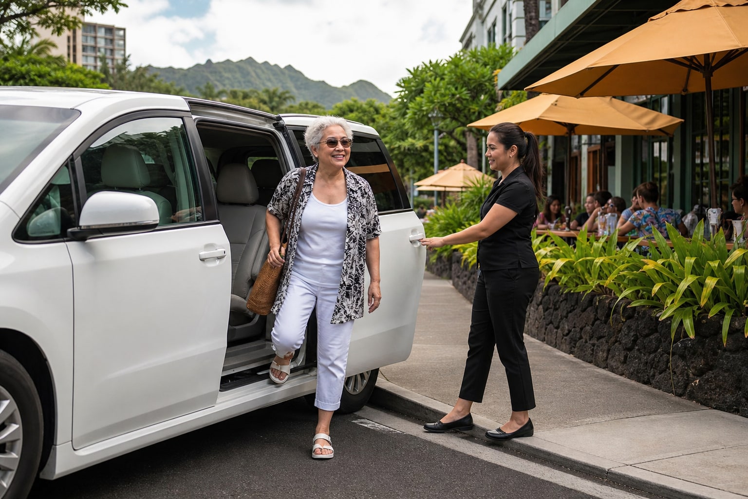 An older woman stepping from a white passenger minivan as a female driver assists