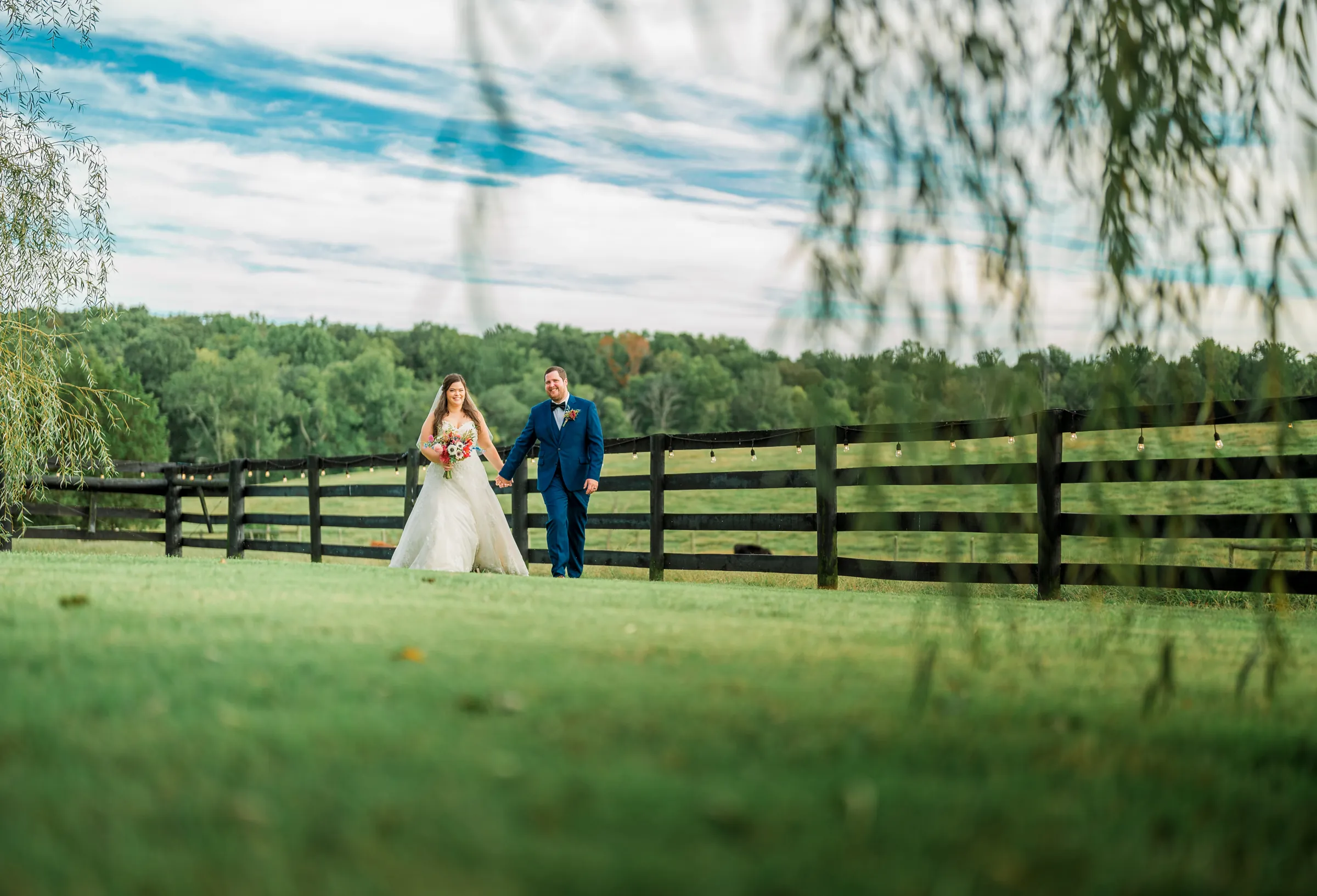 Couple sharing a moment in the field at Oak Creek Farm