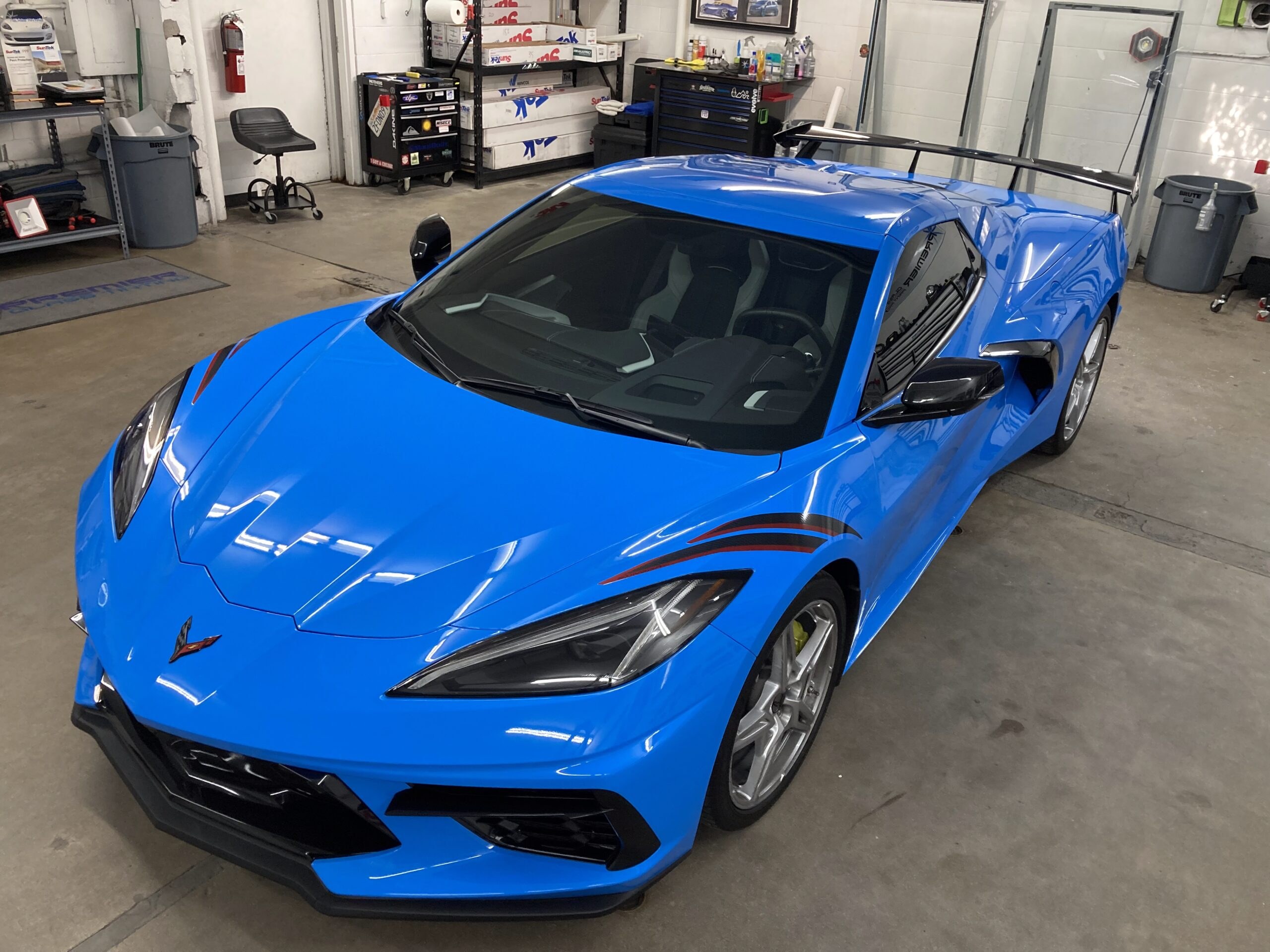 Blue Corvette inside the Premier Glass Tinting workshop