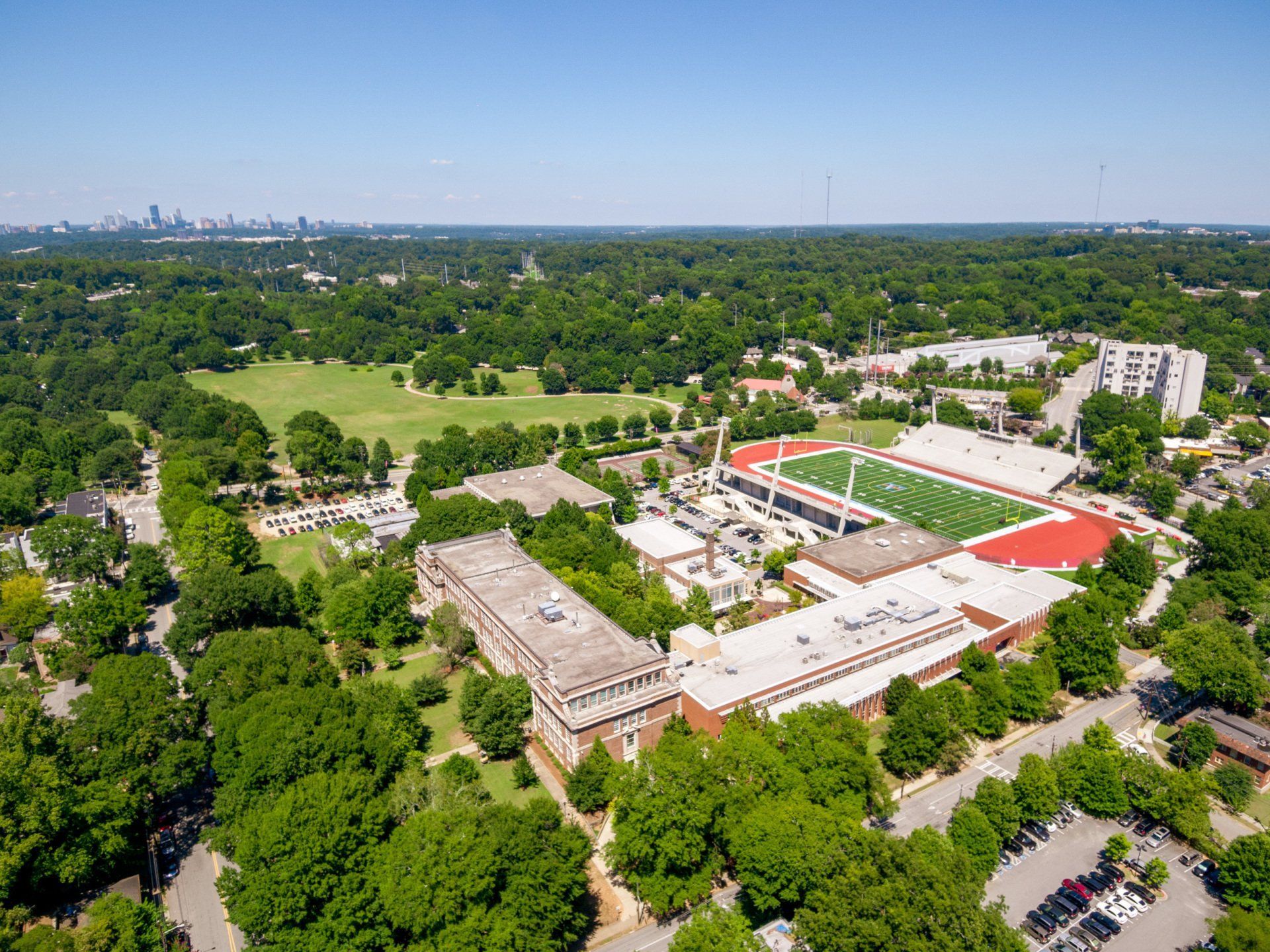 An aerial view of a college campus surrounded by trees and buildings.
