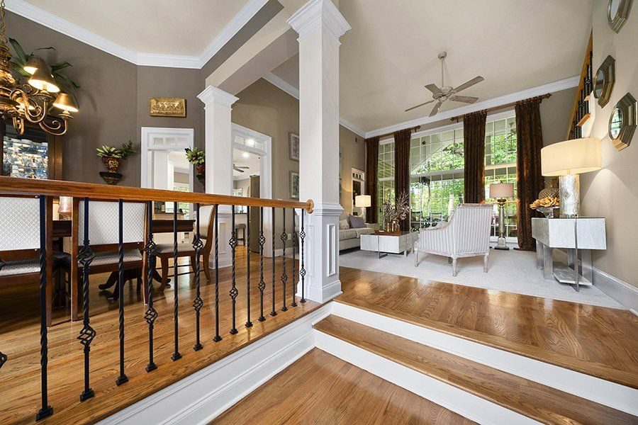 Open living area with wood floors and stairs