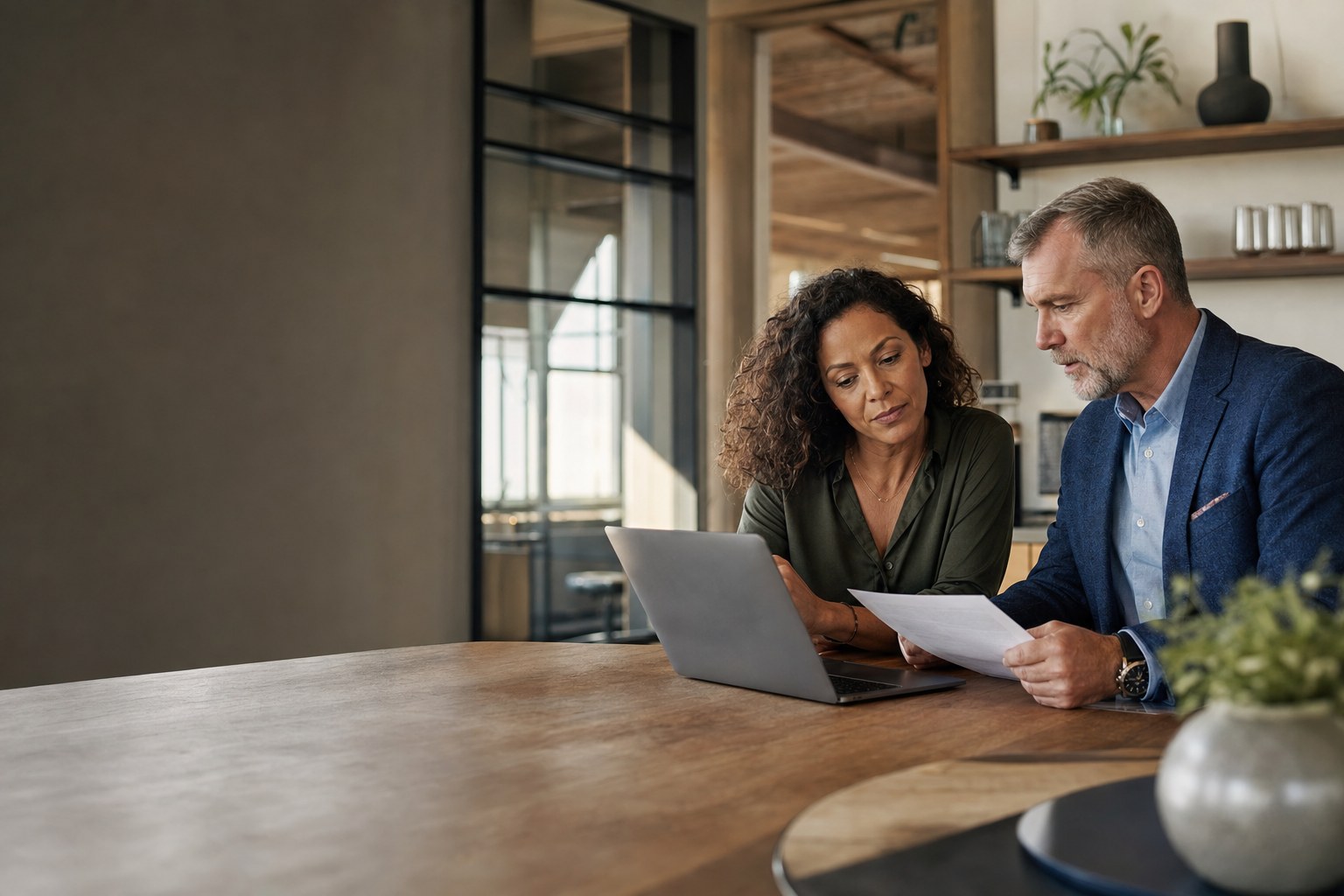 A business manager and IT professional reviewing a continuity plan