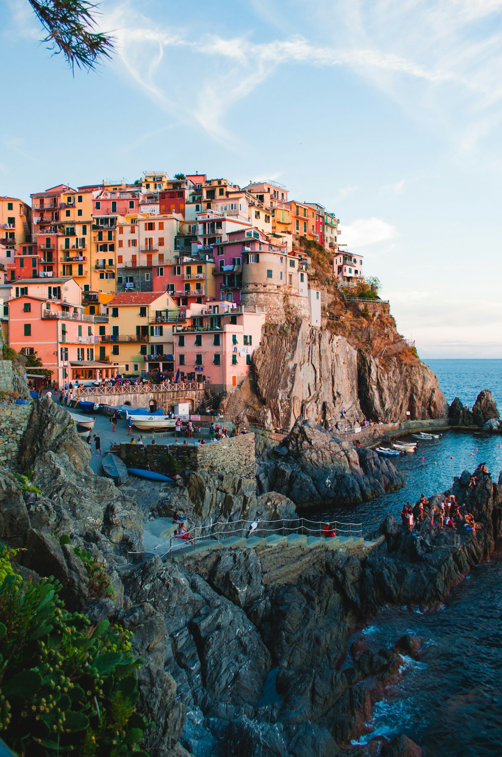 Colorful buildings above the rocky coast in Manarola, Cinque Terre