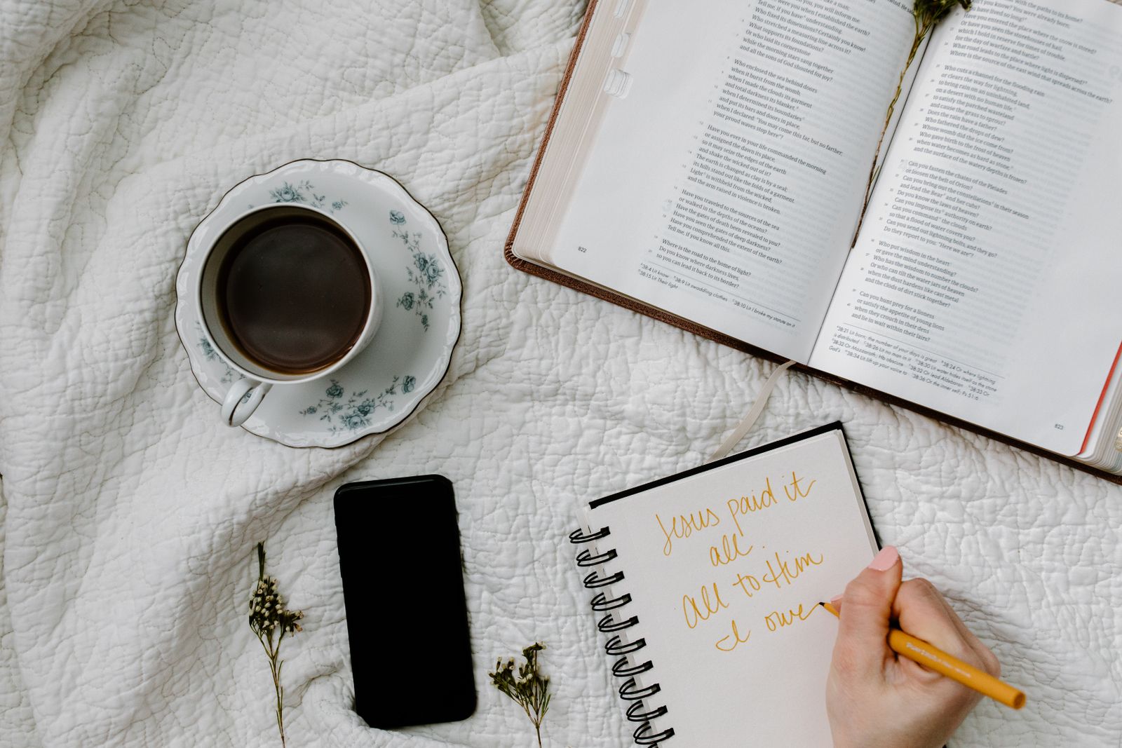 Bible, coffee, and journal arranged for a quiet reading time