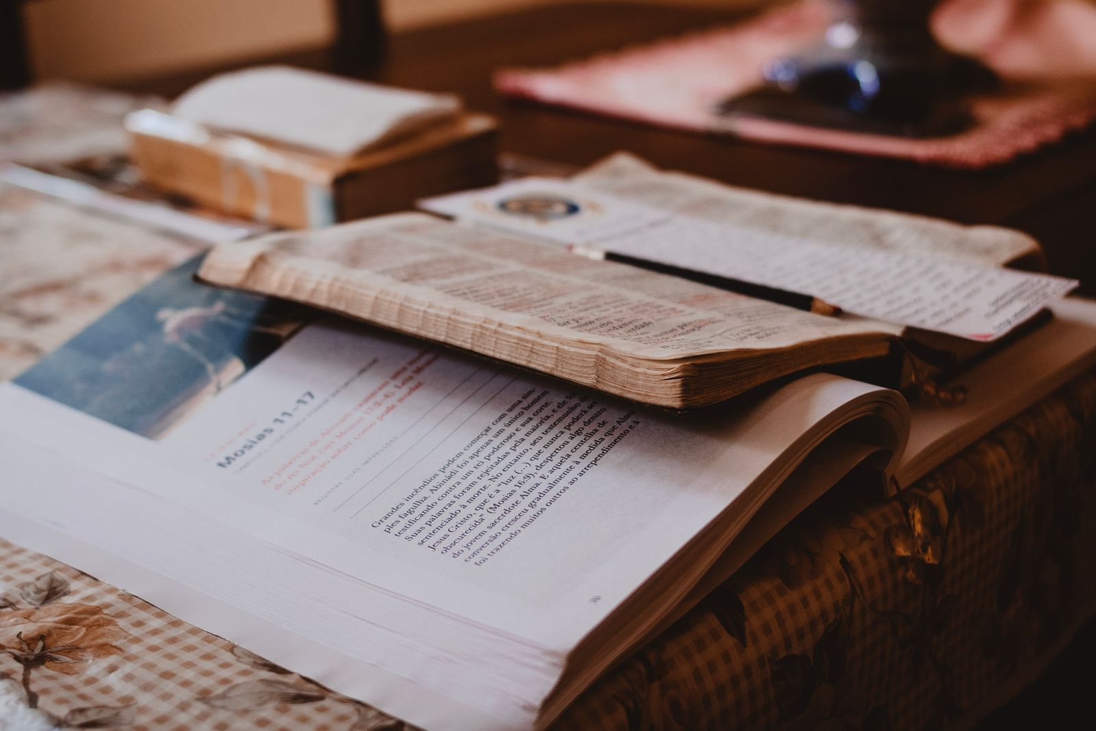 Open Bible and notebook on a table