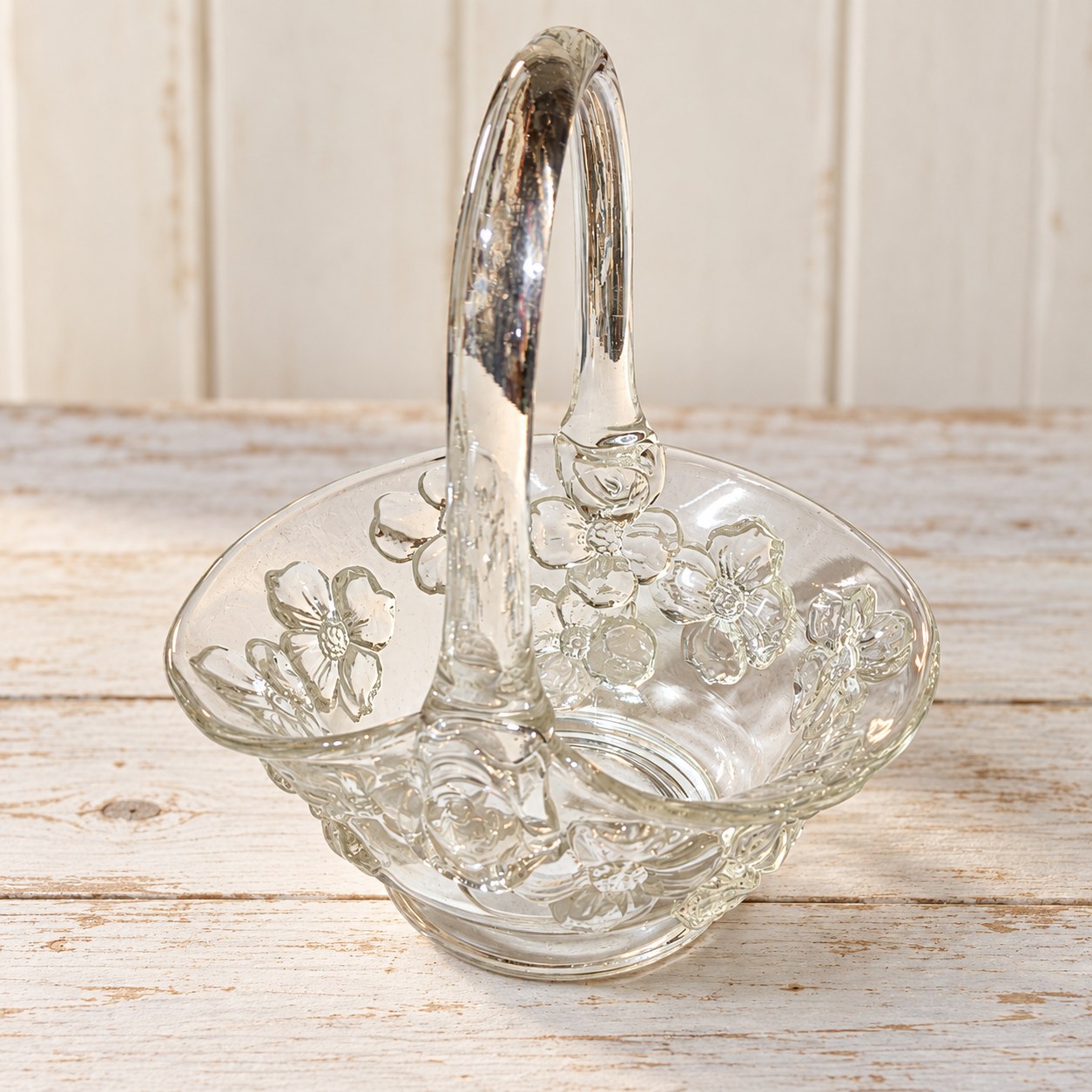 Vintage clear pressed glass basket with a dogwood flower pattern