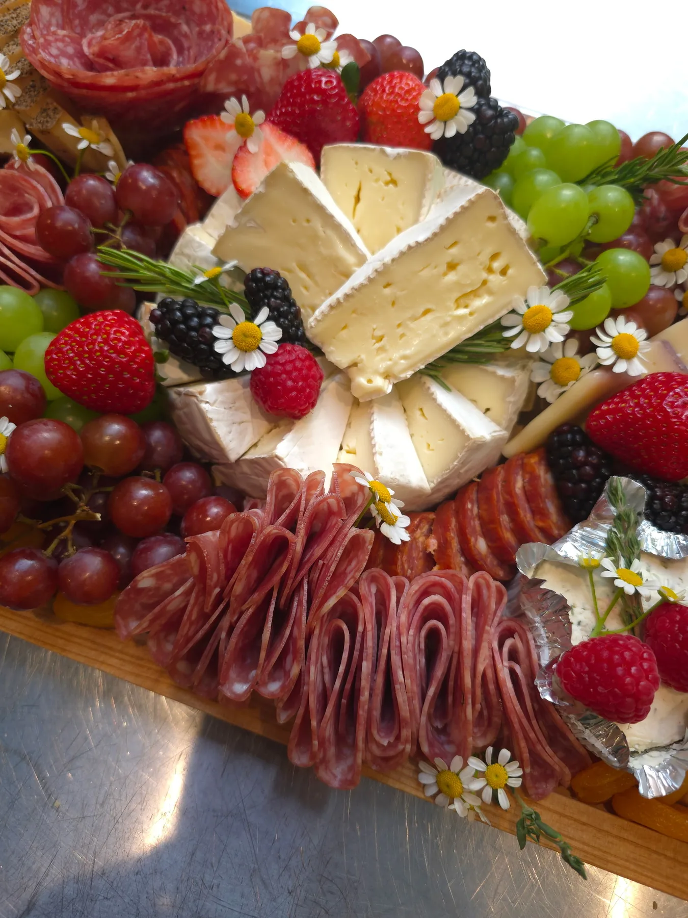 A grazing board with berries and cheese