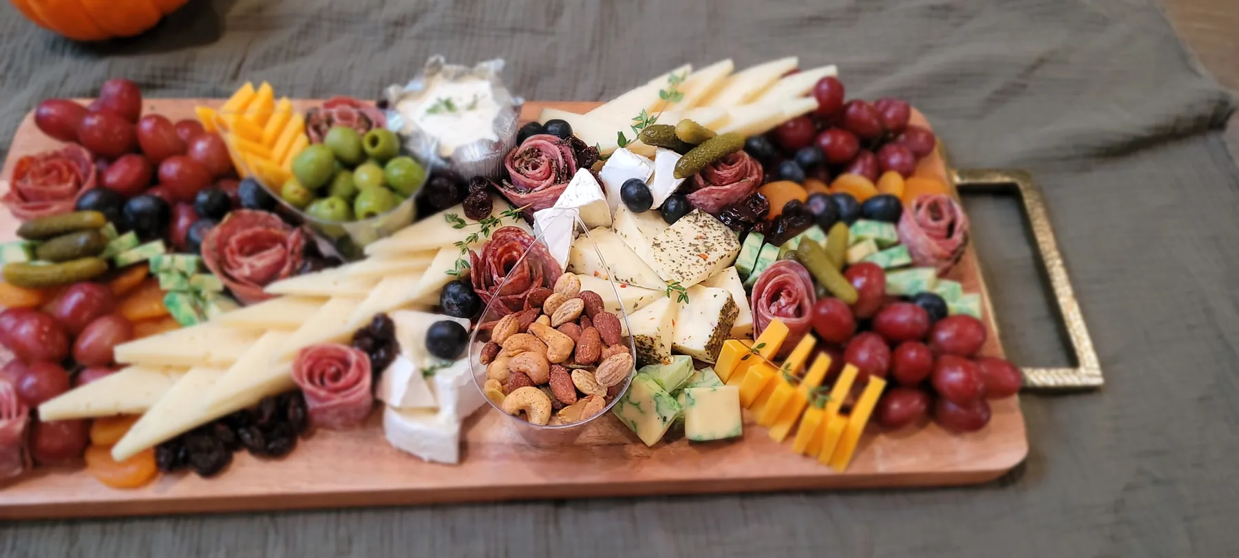 A colourful charcuterie board with fruit and cheese