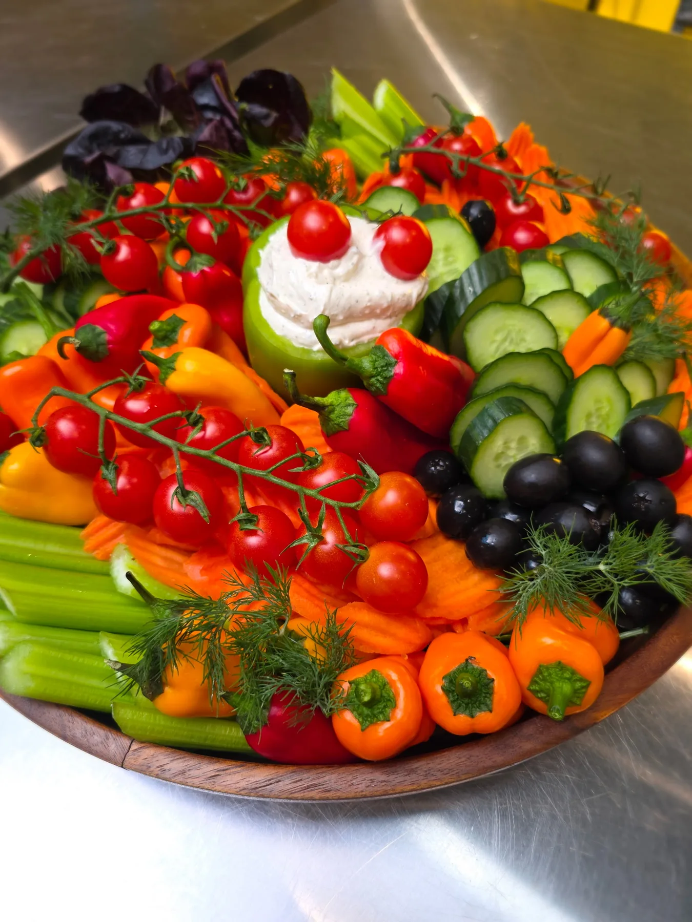 A vibrant vegetable platter with fresh fruit