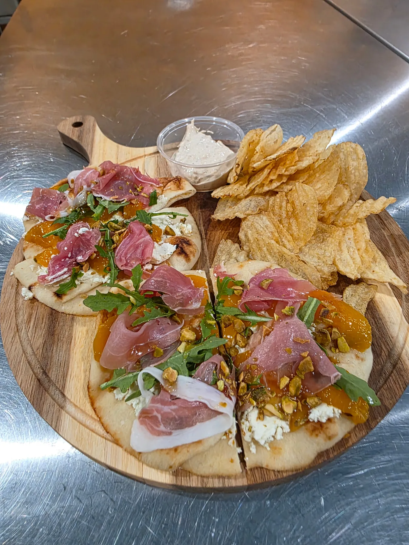 A grazing plate of meats, cheeses and crackers