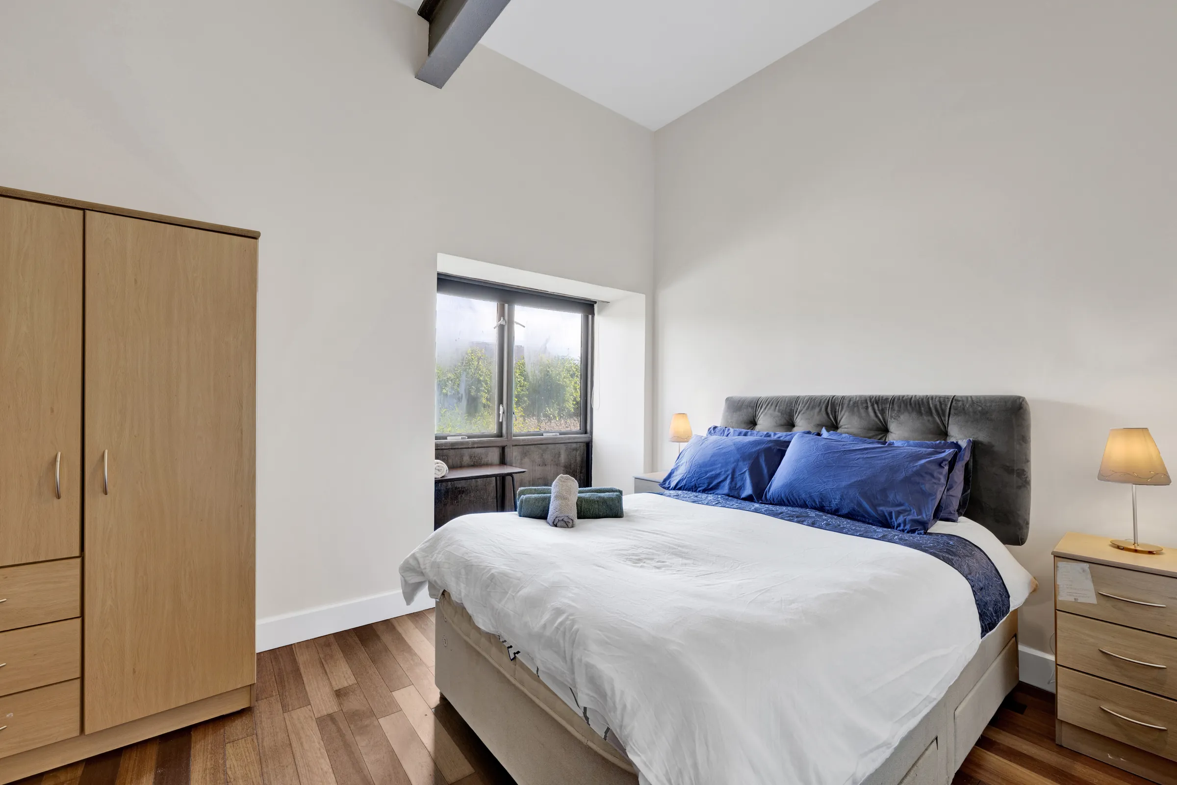 Bright bedroom with blue accents