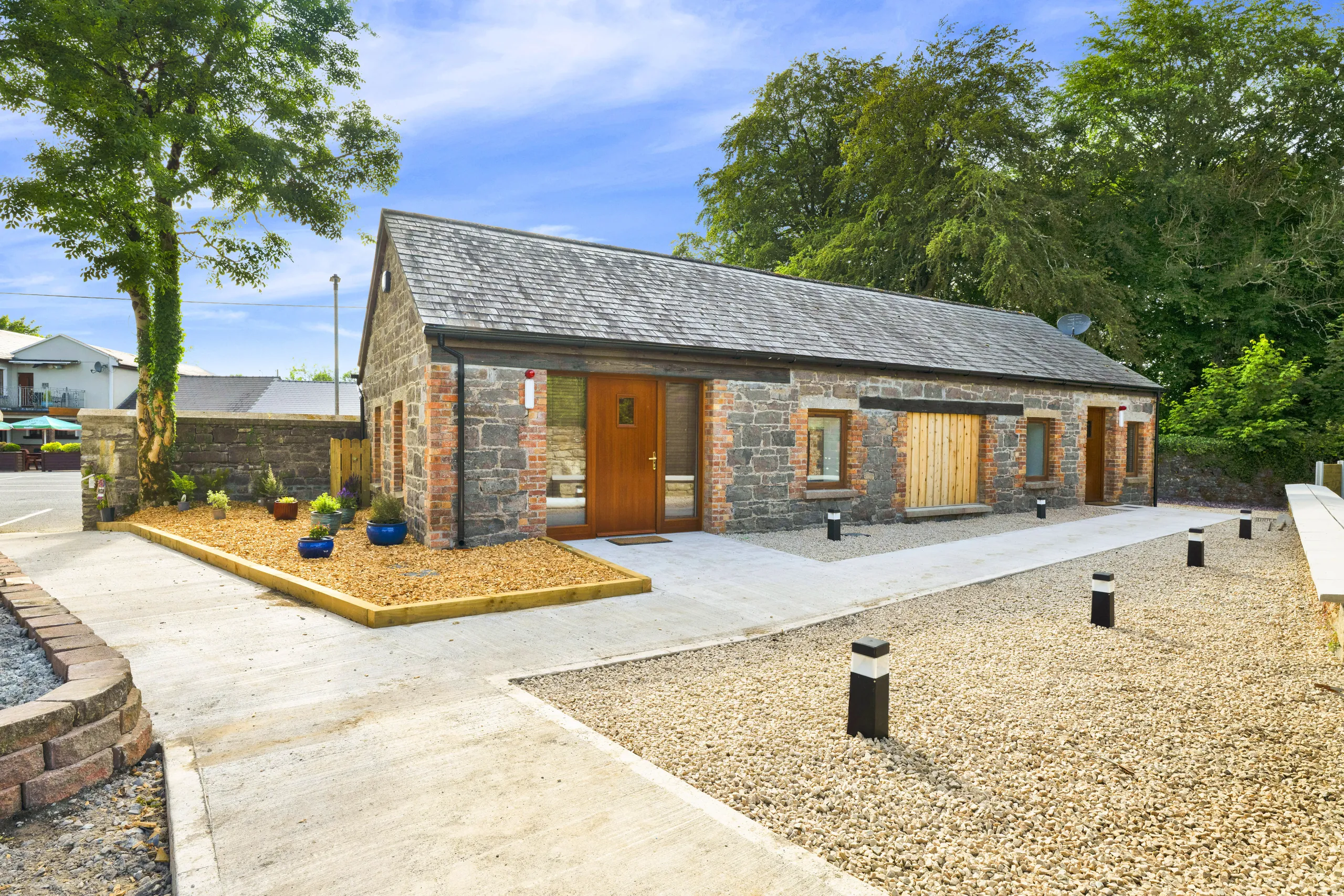 Stone outbuilding and landscaped grounds