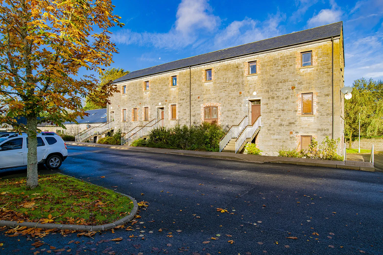 Stone mill exterior in autumn light