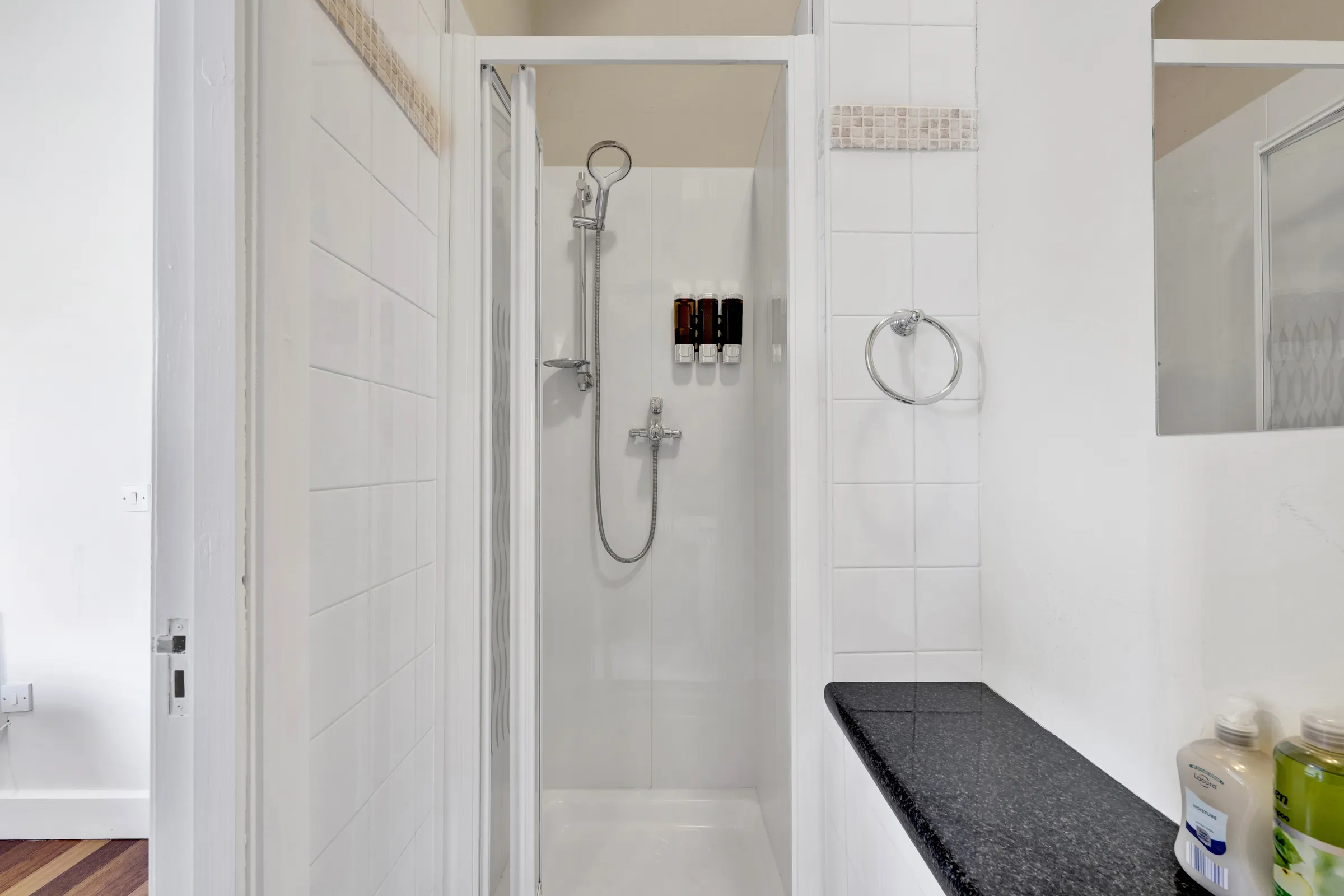 White tiled shower room
