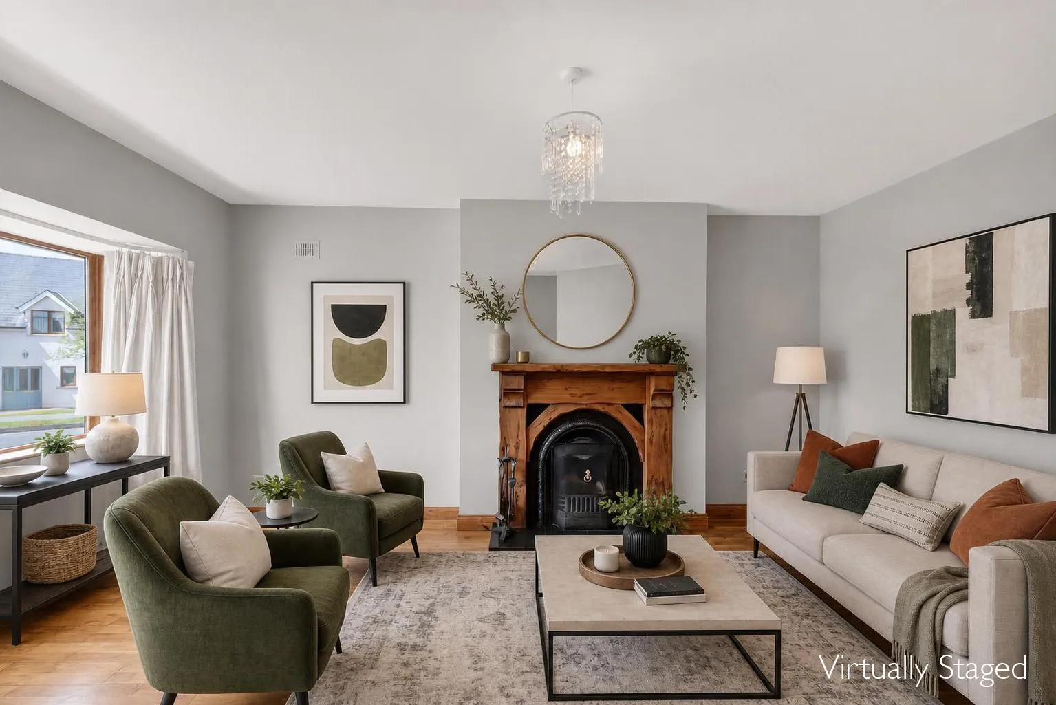 After virtual staging: living room furnished with neutral seating and green armchairs