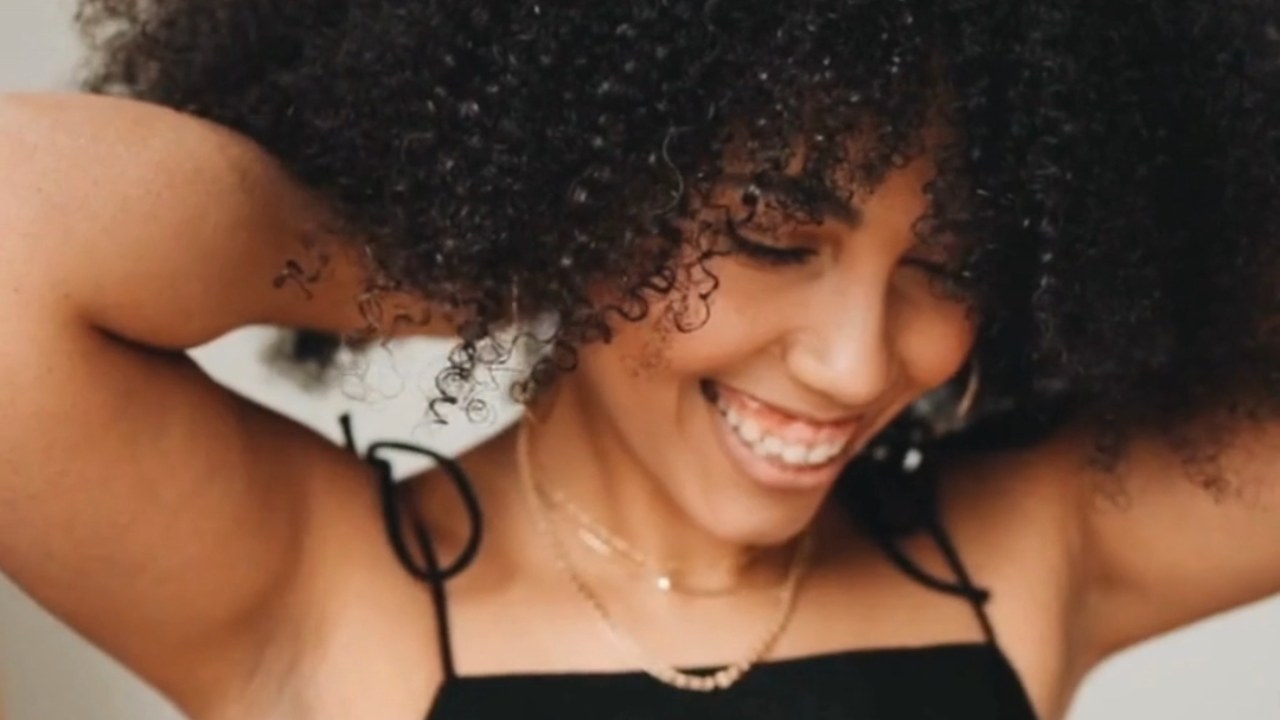 Woman enjoying a natural hair care ritual