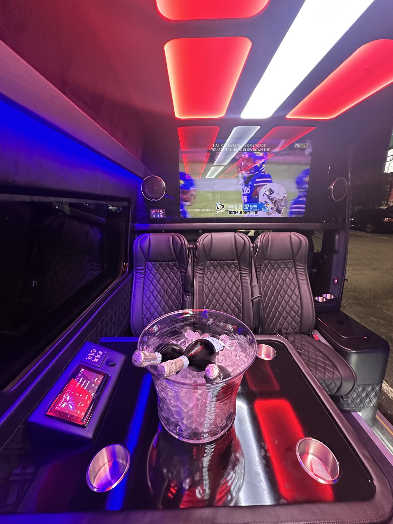 Red and blue lighting inside a luxury passenger cabin