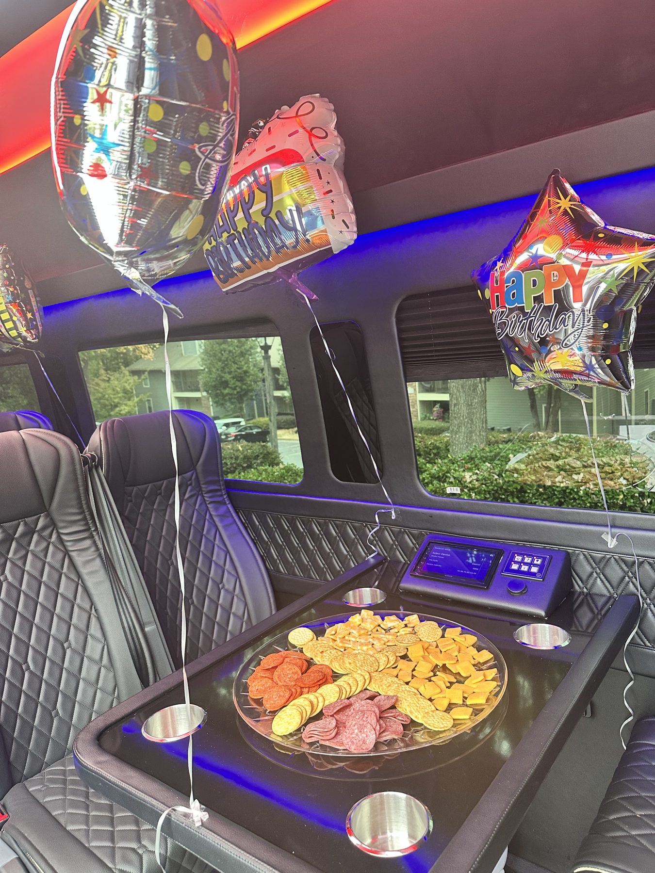 Celebration decorations and refreshments inside a van