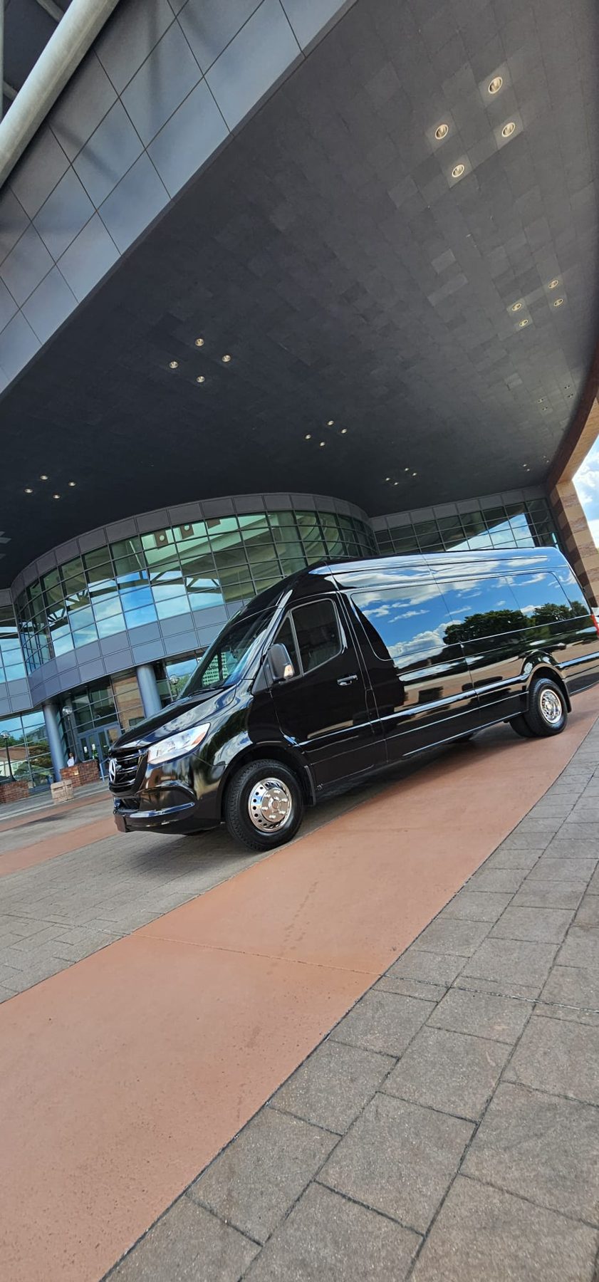 Black SUV under a covered entrance