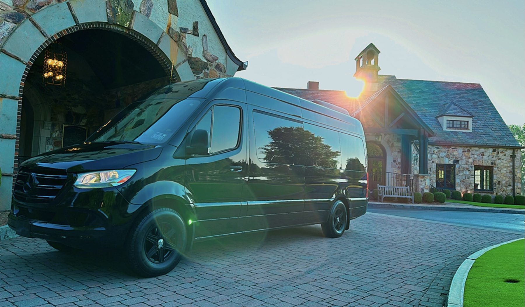 Black Sprinter outside a brick venue