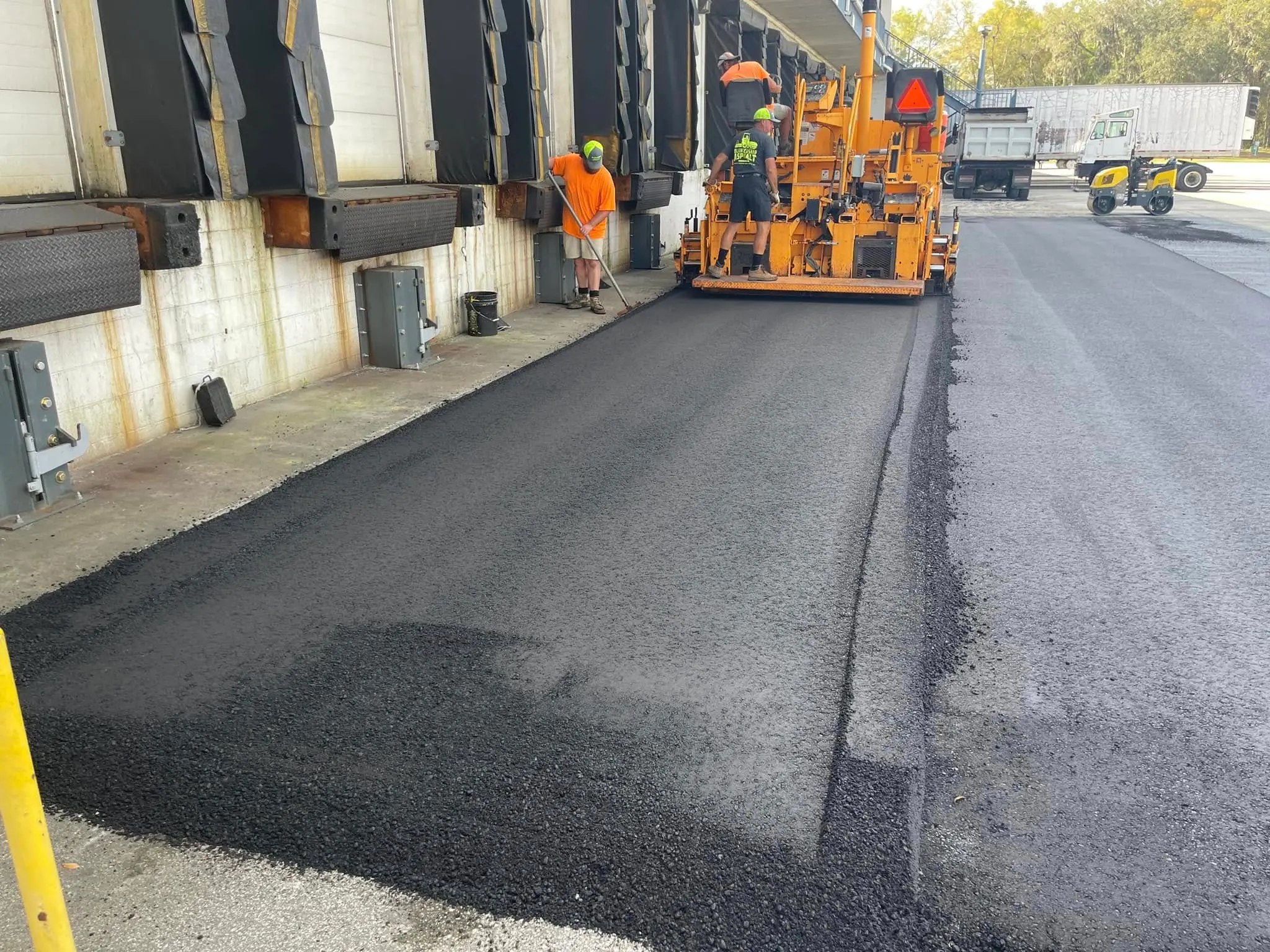 Advanta Asphalt crew paving a commercial loading area