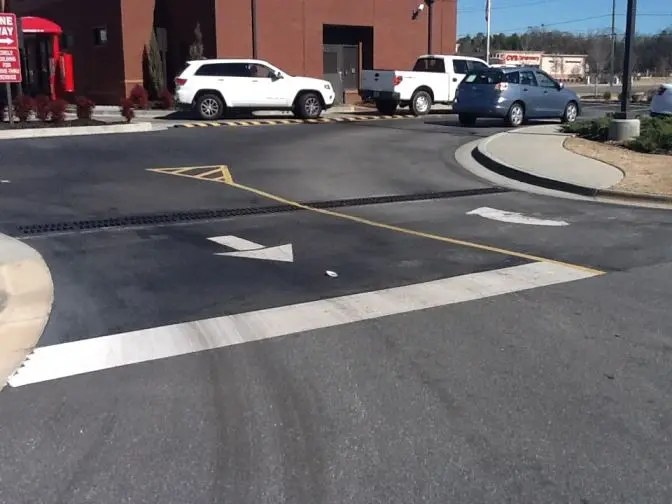 Damaged commercial pavement before repair