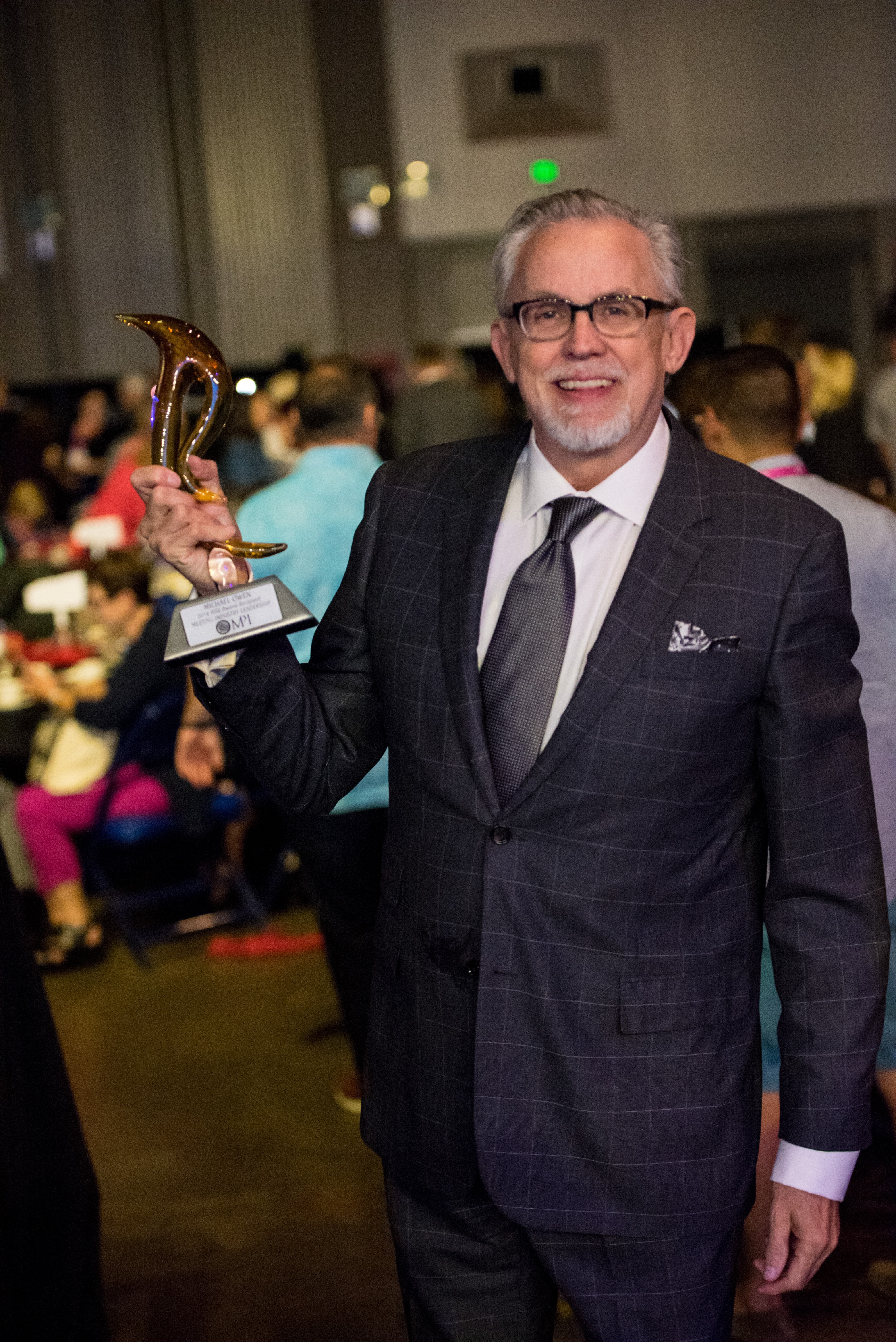 Michael Owen receiving meeting industry leadership recognition