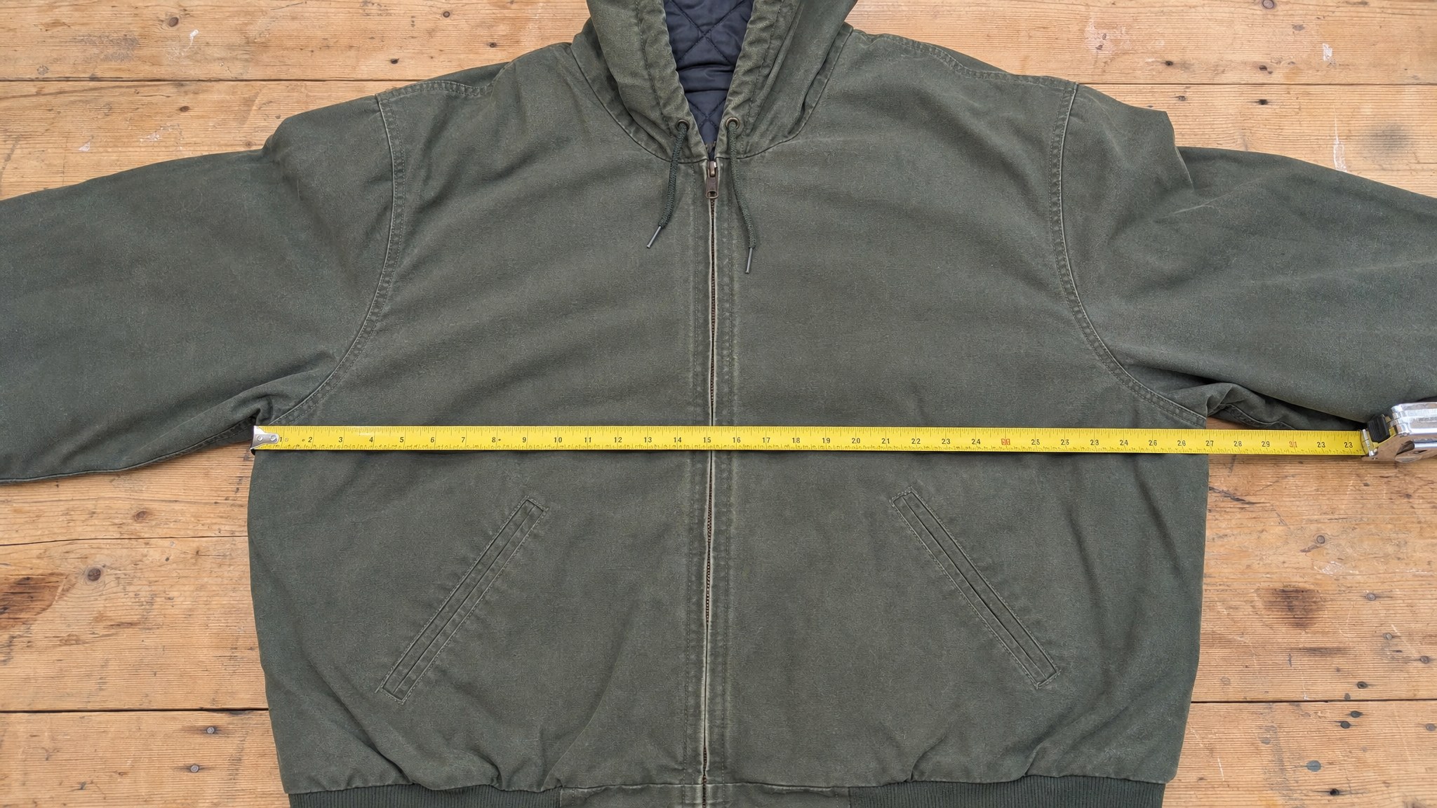 Olive hooded canvas work jacket measured flat from underarm seam to underarm seam