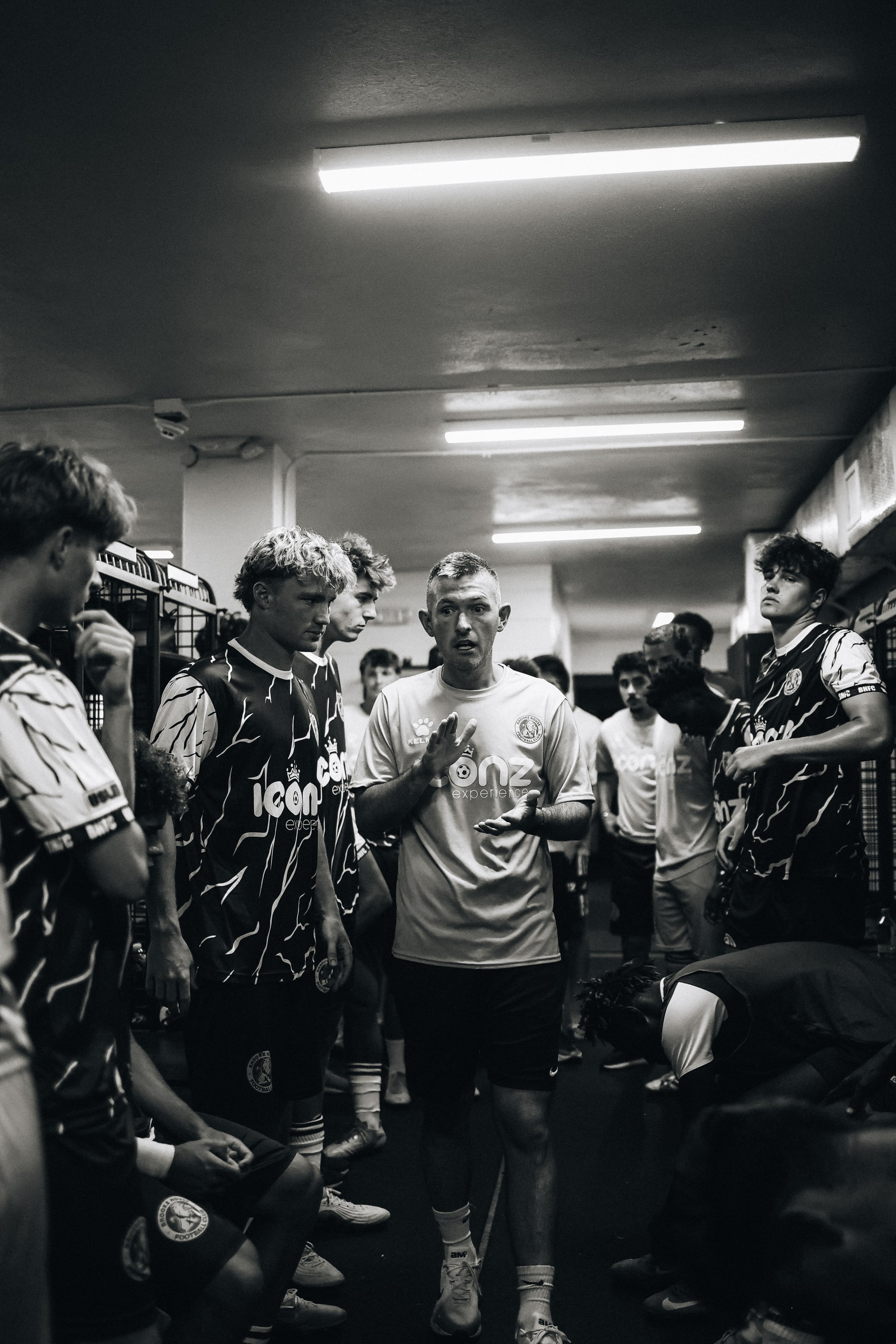 Brooke House FC players listening together before a match