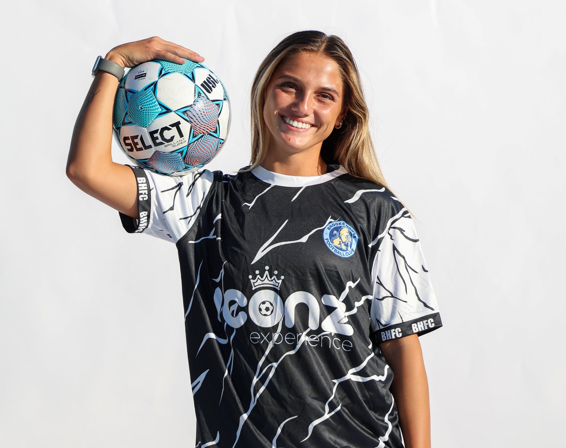 Brooke House FC women's player balancing a soccer ball