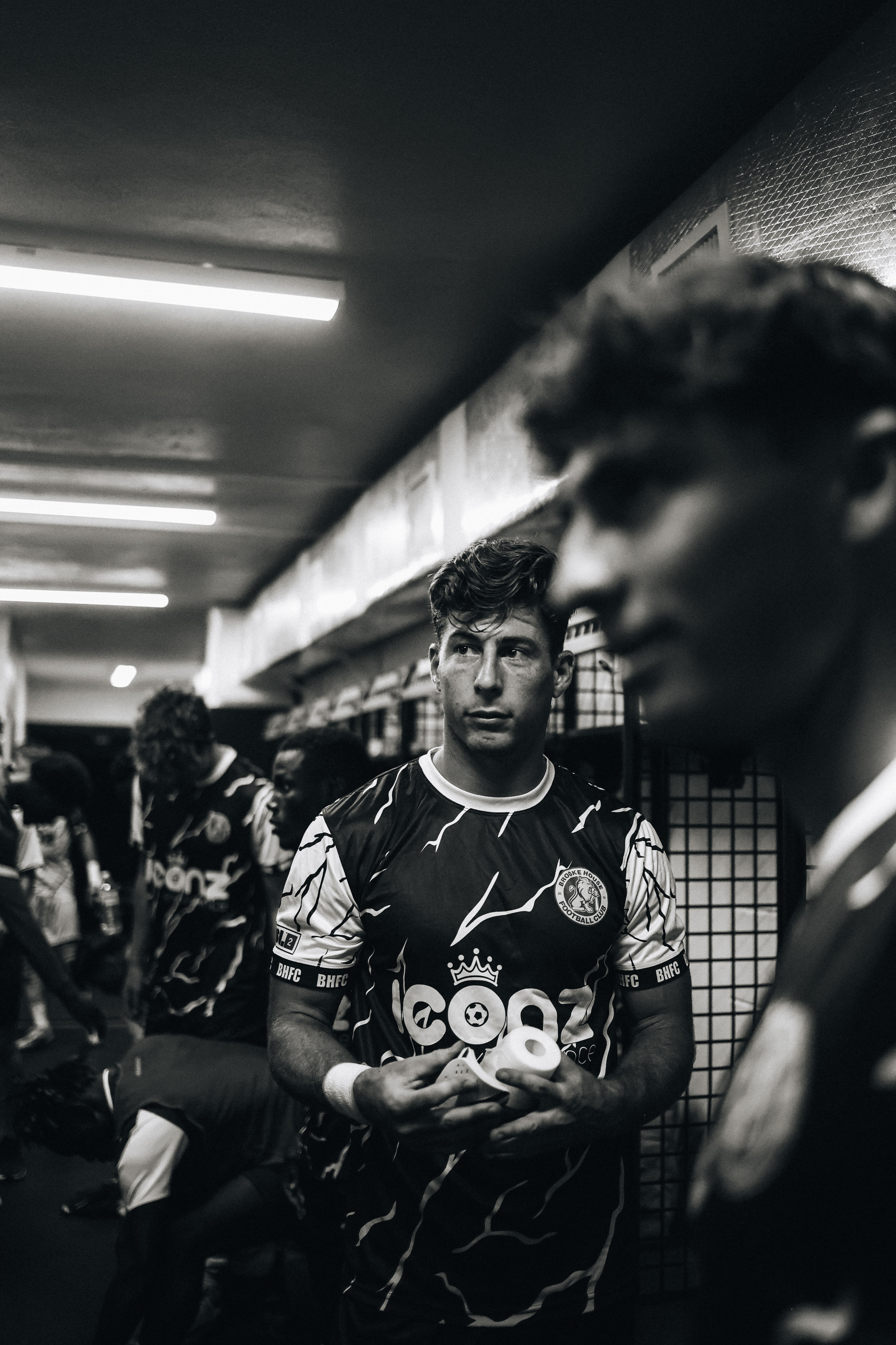 Brooke House FC player preparing in the locker room