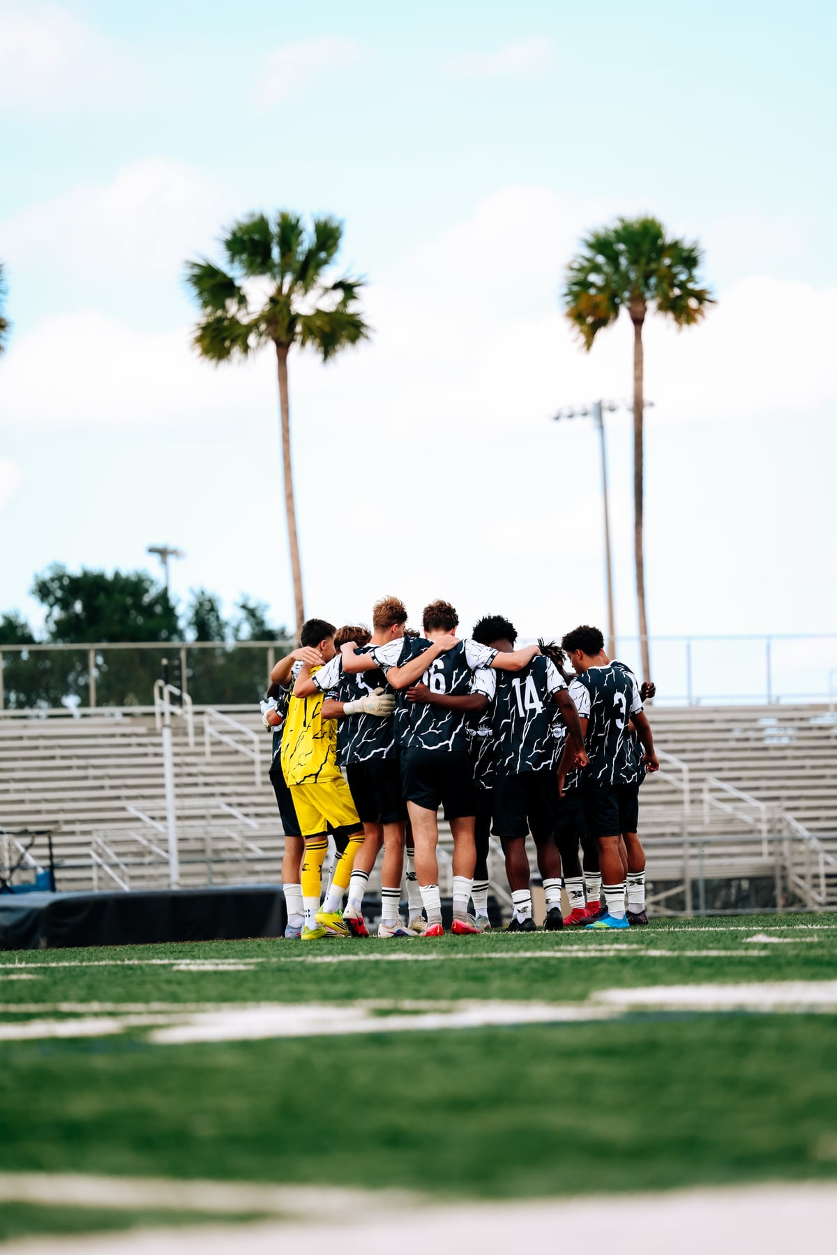 Brooke House FC players listening together before a match
