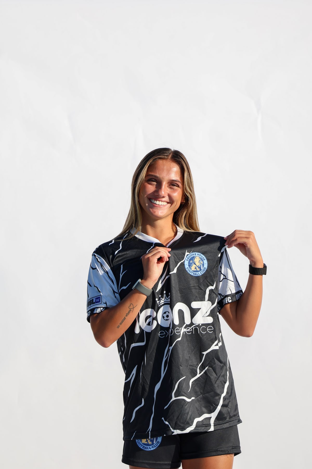 Brooke House FC women's player showing the club crest on her jersey