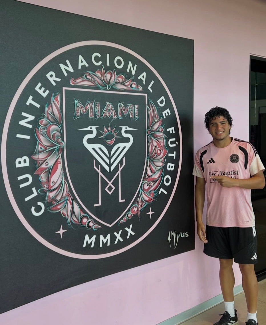 Isaiah Vicentti wearing an Inter Miami CF jersey beside the club crest