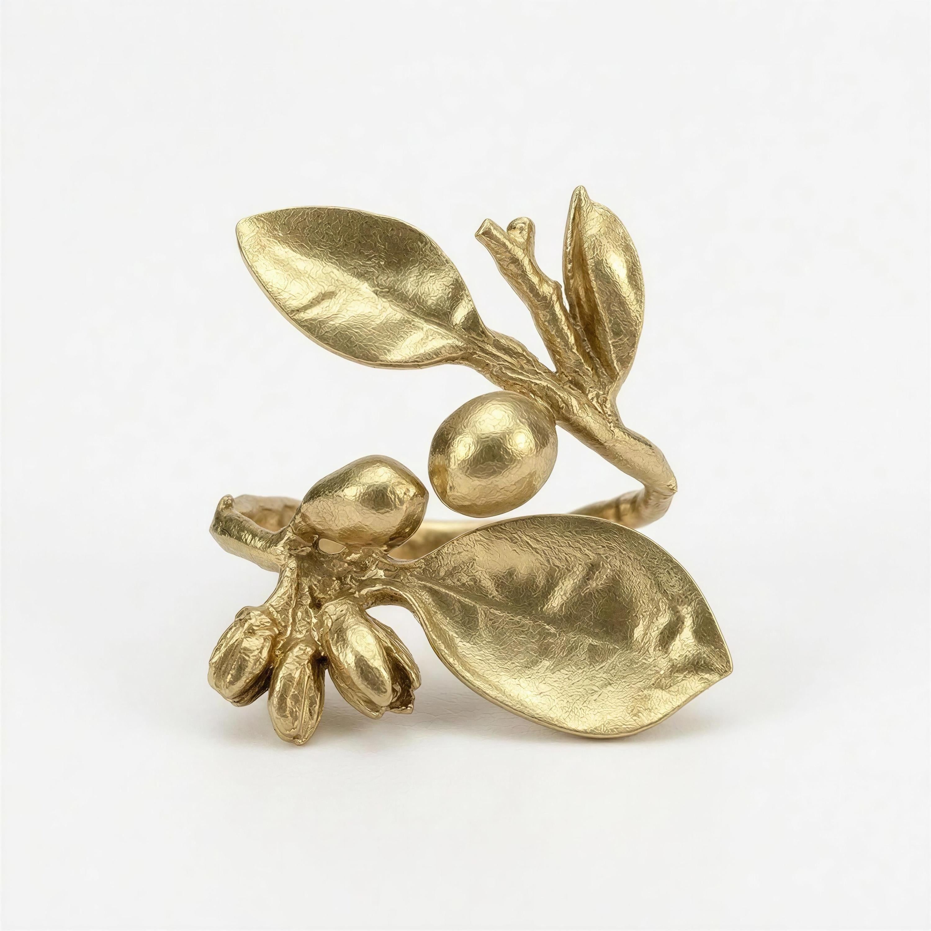 Hand-cast pewter lemon branch napkin rings with raised botanical detail