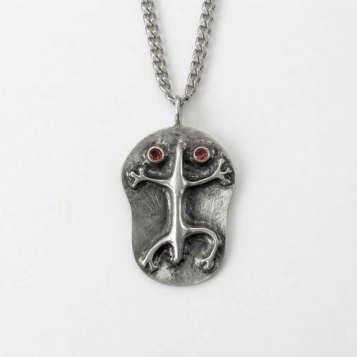 Hand-cast pewter Coquí frog pendant with red accents on a chain