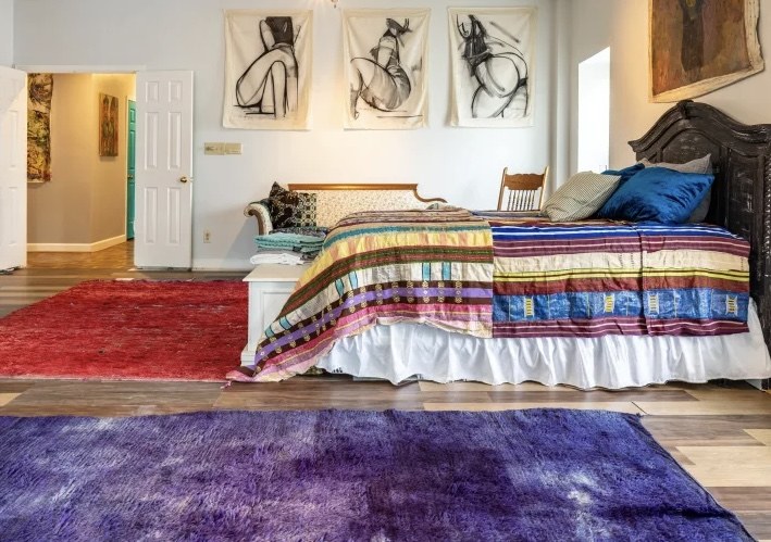 Interior shown with art and textiles